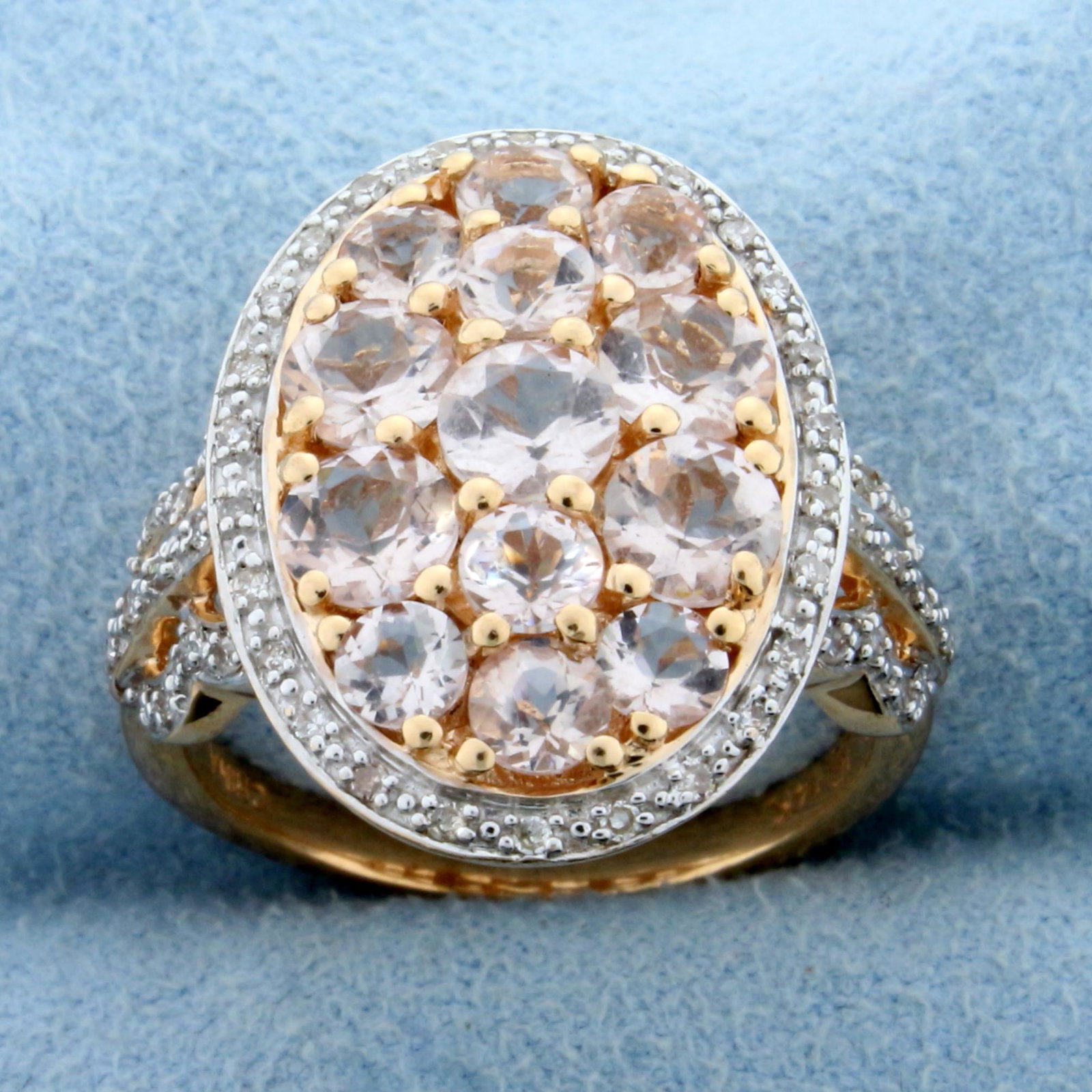 Natural Morganite and Diamond Halo Ring in 14K Rose: In 14K Rose Gold. Contains five 4.5mm and eight 3mm High Quality Natural Morganite gemstones with beautiful pink salmon color and excellent clarity. Also contains fifty 1/2pt Diamonds. Over 2.5ct of g