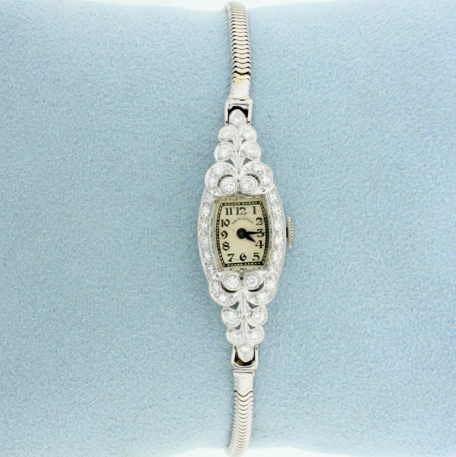 Antique womens Diamond Windup Hamilton Wrist Watch in: Case and Bezel in Platinum, band in solid 14k White Gold. Windup movement runs great. Contains 1/2ct TW of diamonds, VS clarity/H color. 6 1/2 inches long. Safety chain. 17.9g