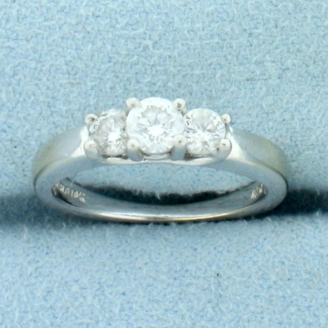 Three-Stone Diamond Wedding or Anniversary Ring in 14K: In 14K White Gold Shank and Platinum Heads. Contains one high quality .2ct and two .1ct round brilliant cut Diamonds, SI clarity/G color. Size 4 3/4. 3.5g