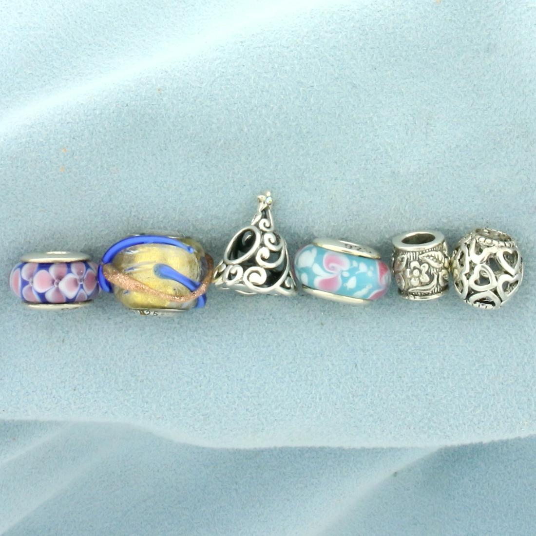 Set of Six Bead Charms in Sterling Silver: In Sterling Silver. Six unique charms. Ranging from 8-15.4mm long each. 13.5g