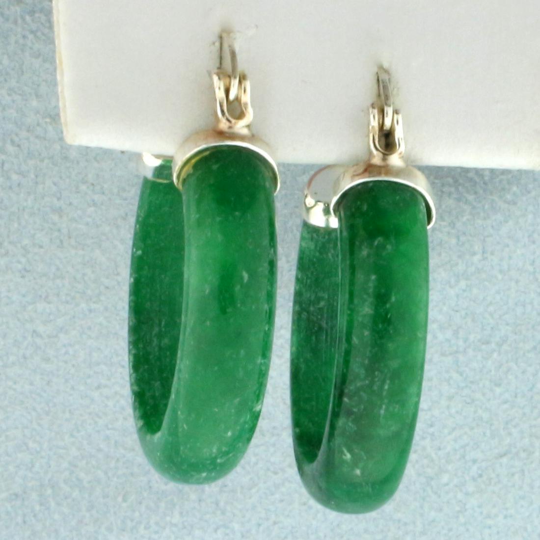 Jade Hoop Earrings in Sterling Silver: In Sterling Silver. 1 1/8 inches long. 5mm wide. 5.8g