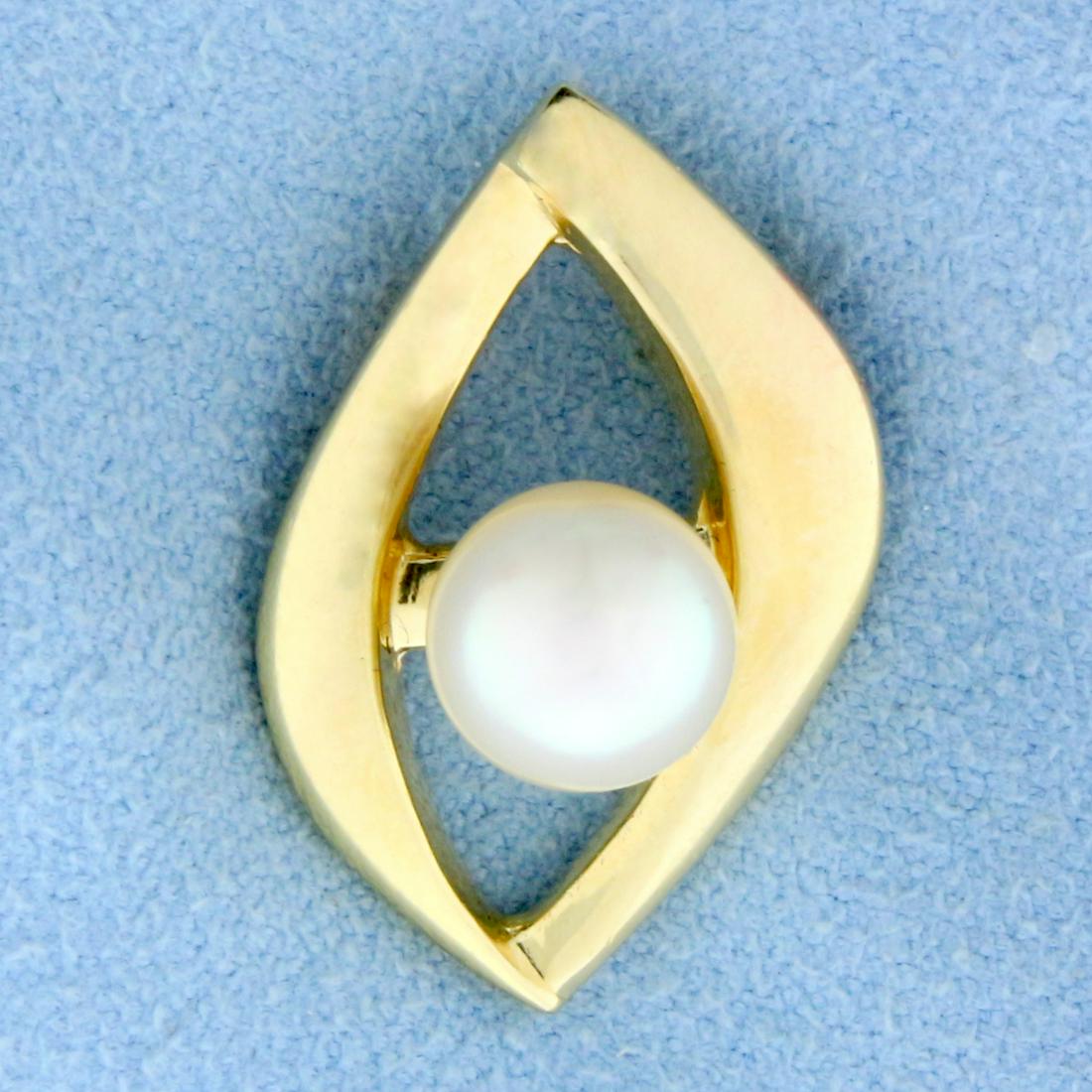 Abstract Design 7.5mm Akoya Pearl Pendant or Slide in: In 14K Yellow Gold. Contains a 7.5mm Cultured Akoya Pearl with mirror like luster and bright color. 1 inch long. 3.6g