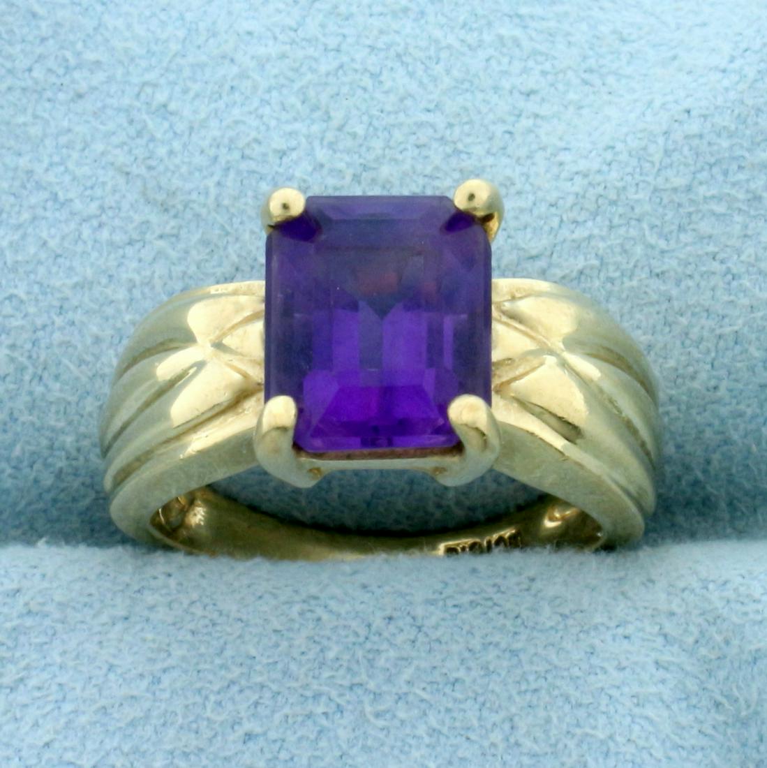 3ct Amethyst Solitaire Ring in 10K Yellow Gold: In 10K Yellow Gold. Contains one high quality natural 10x8mm emerald cut Amethyst gemstone with intense purple color and excellent clarity. Size 6. 4.2g