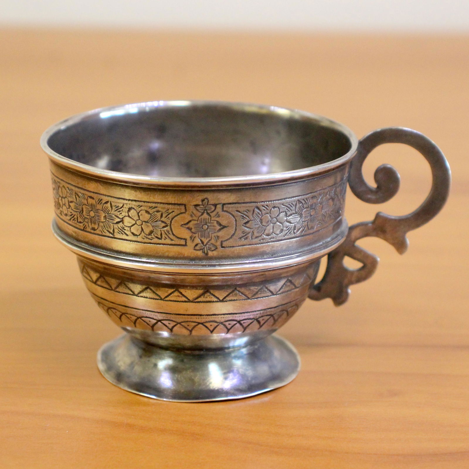 Antique Hand Engraved Sterling Silver Tea Cup: In sterling silver. Made in 1874. 2 inches tall. 3 inches wide. 85.7g