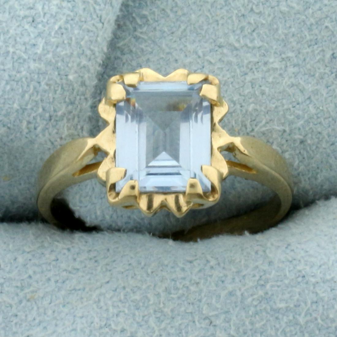 1.25ct Aquamarine Solitaire Ring in 10K Yellow Gold: In 10K Yellow Gold. Contains one high quality natural 1.25ct emerald cut Aquamarine gemstone with beautiful pastel blue color and excellent clarity. Size 6. 2.2g.