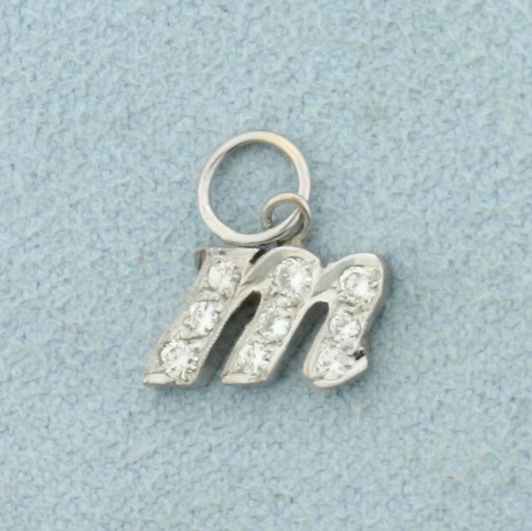 Diamond Initial M Charm in 14K White Gold: In 14K White Gold. Contains five .02ct and four .01ct high quality Diamonds, VS clarity/G color. 1/2 inch long with jump ring. 0.7g.