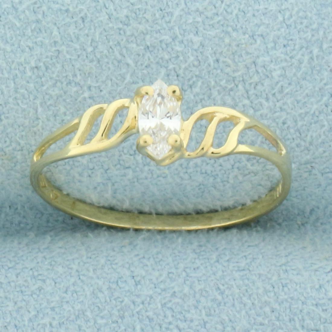 CZ Solitaire Engagement Ring in 10K Yellow Gold: In 10K Yellow Gold. Contains one high quality 6 x 3mm 1/3ct marquise cut CZ gemstone with excellent clarity and lots of sparkle. Size 7. 0.9g.