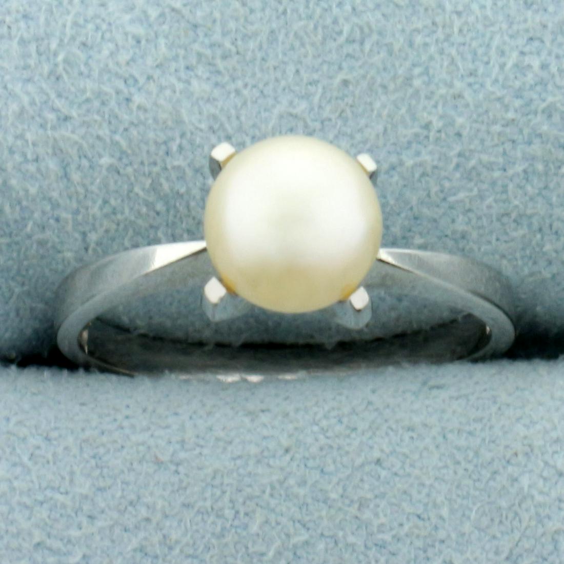 7MM Akoya Pearl Solitaire Ring in 18K White Gold: In 18K White Gold. Contains one high quality natural 7mm cultured Akoya Pearl with beautiful pink undertones and high luster. Size 7 1/4. 3.2g.