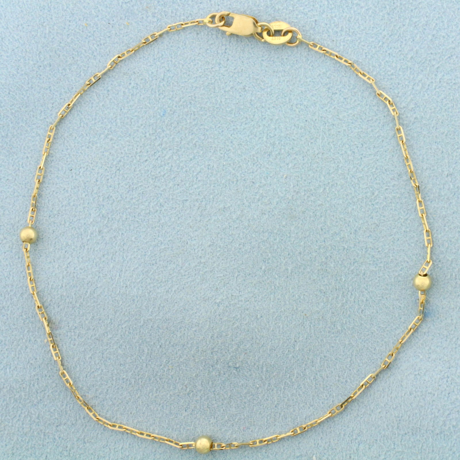 Italian Made Anchor and Bead Link Anklet in 14K Yellow: In 14K Yellow Gold. 9 inch long. Beads are 3mm diameter. Lobster clasp. 1.5g