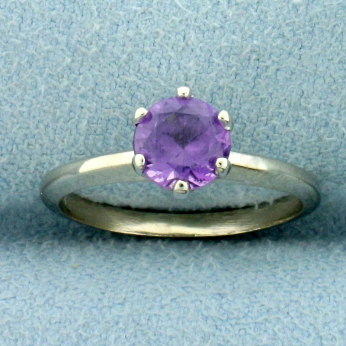 3/4ct Lab Purple Sapphire Solitaire Ring in 10K White: In 10K White Gold. Contains one high quality natural 3/4ct Lab Purple Sapphire gemstone with pastel purple color and excellent clarity. Size 4 1/4. 1.9g
