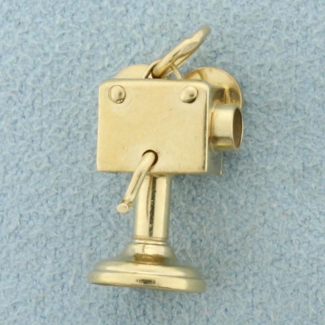 Vintage Movie Camera Charm or Pendant in 14K Yellow: In 14K Yellow Gold. Turning handle moves. 5/8 inch long. 2.4g.