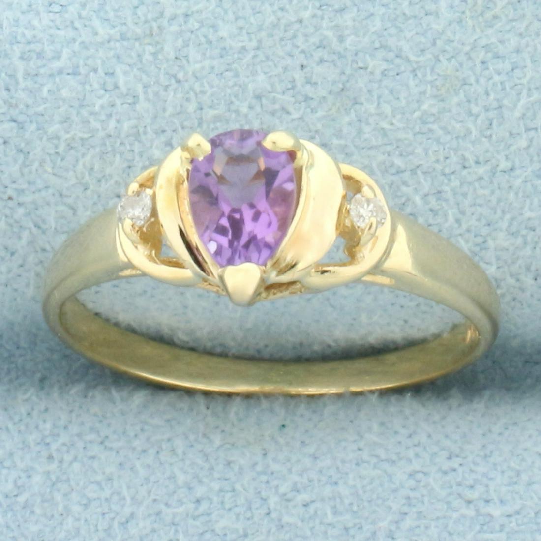 Amethyst and Diamond Ring in 14K Yellow Gold: In 14K Yellow Gold. Contains one high quality natural 5.5 x 4mm pear cut Amethyst gemstone with bright purple color and excellent clarity. Also contains two high quality .01ct Diamonds, I color/I clar