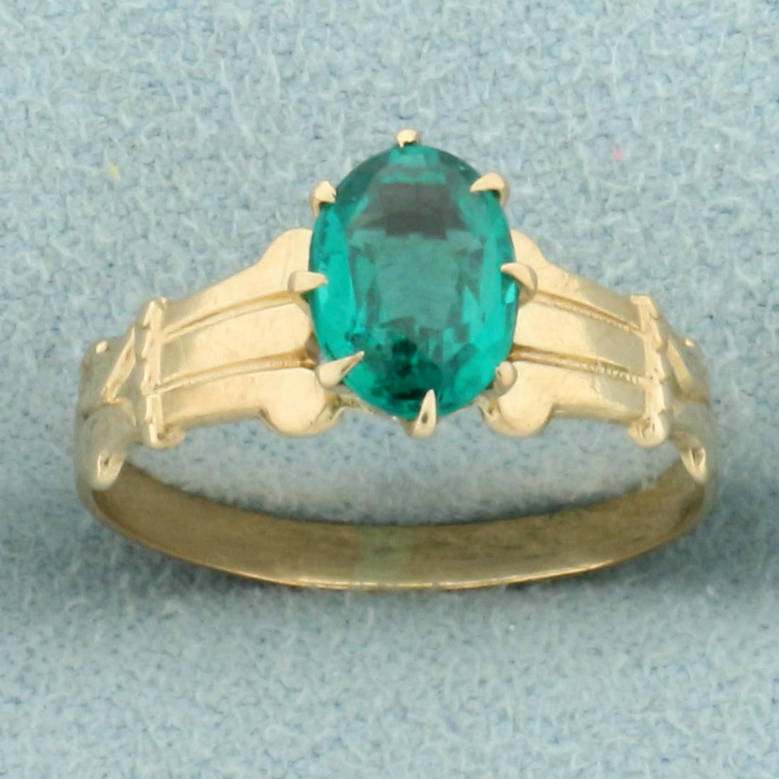 Vintage 1ct Solitaire Lab Emerald Ring in 10K Yellow: In 10K Yellow Gold. Contains one high quality Lab 7 x 5mm oval cut Emerald gemstone with intense green color and excellent clarity. Size 5. 1.2g.