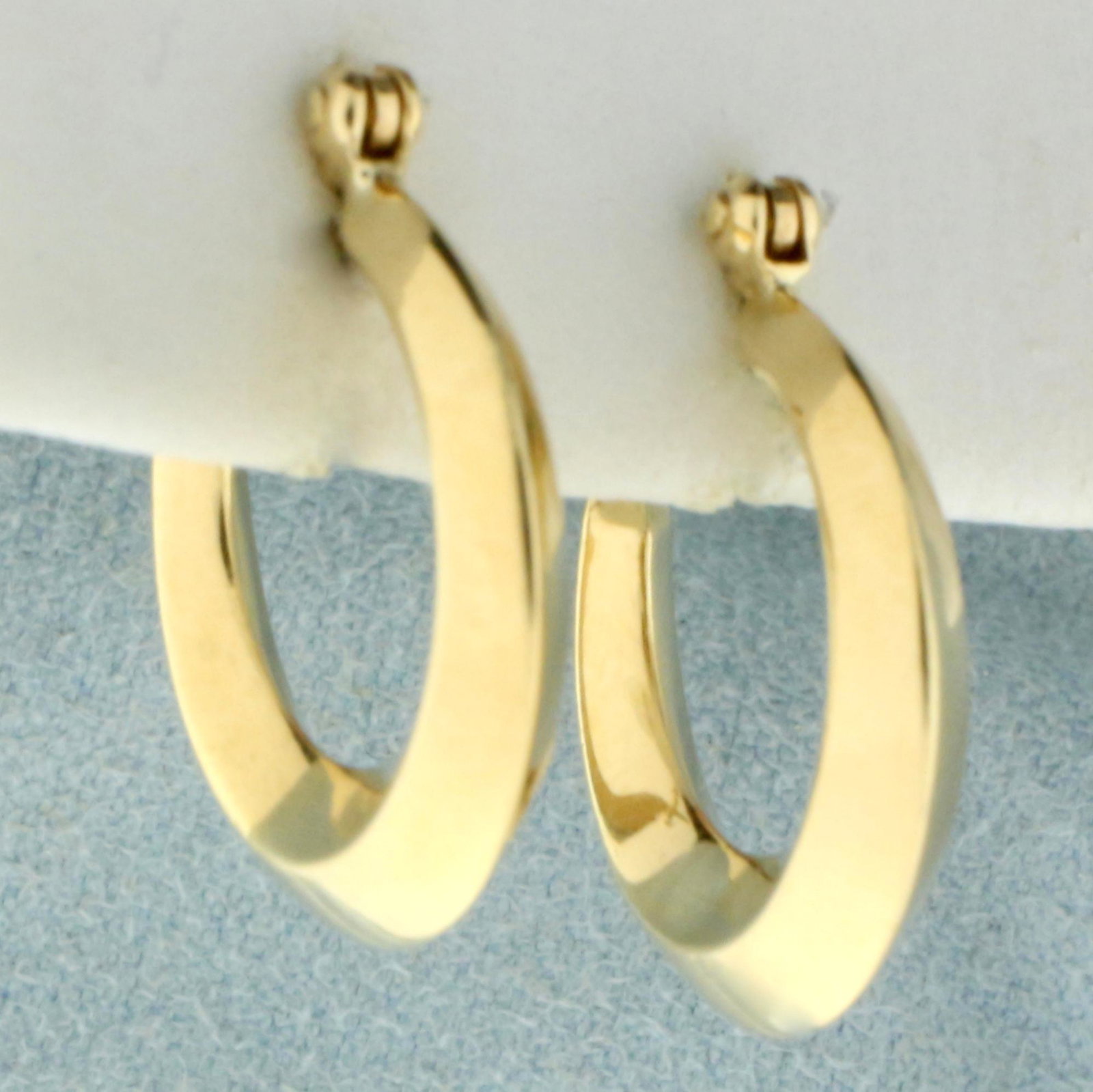 Hoop Earrings in 14K Yellow Gold: In 14K Yellow Gold. 3/4 inch long. 1.2g.