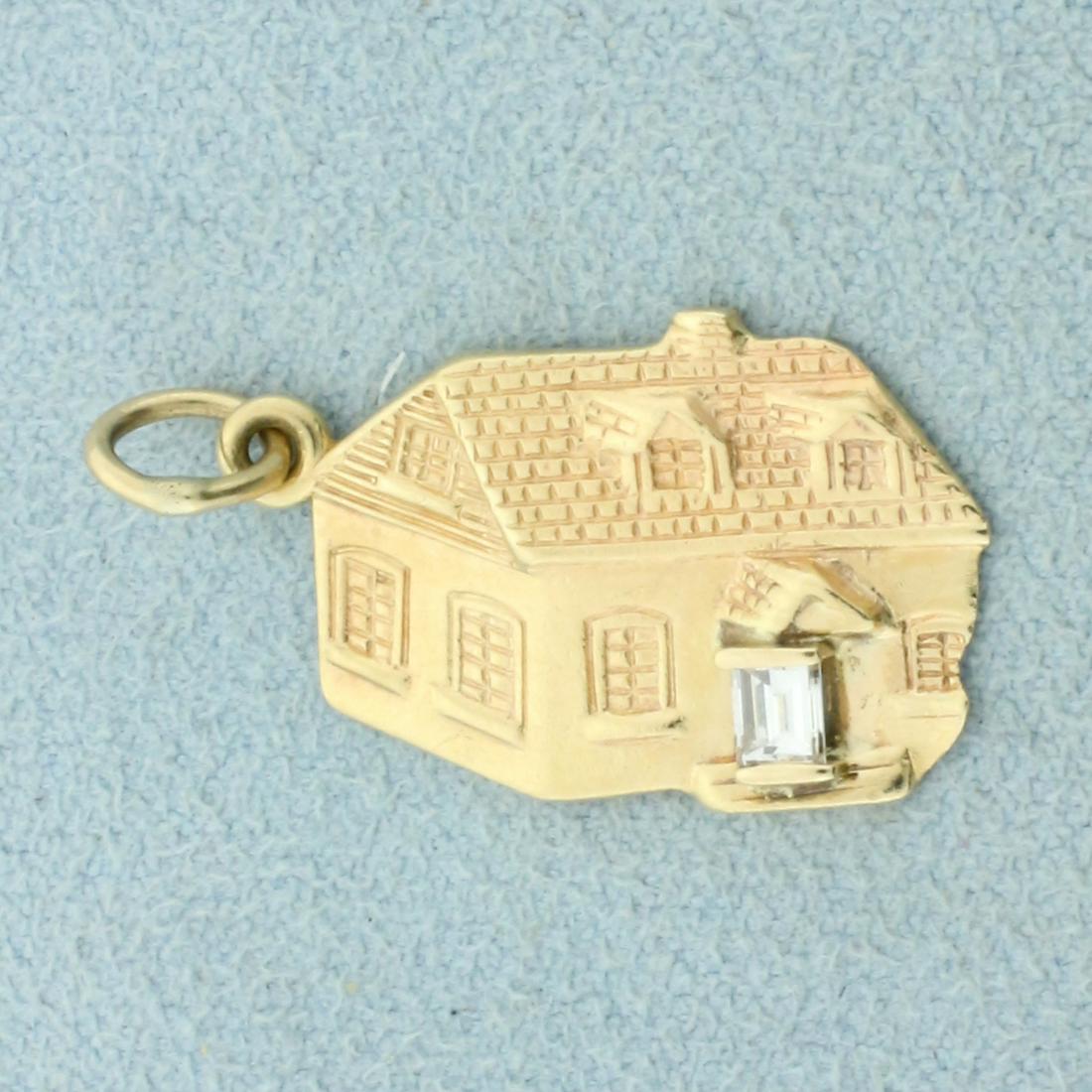 Diamond Home Pendant in 14K Yellow Gold: In 14K Yellow Gold. Contains one high quality 1/8ct emerald cut Diamond, VS clarity/F color . 1 inch long with jump ring. 2.7g.