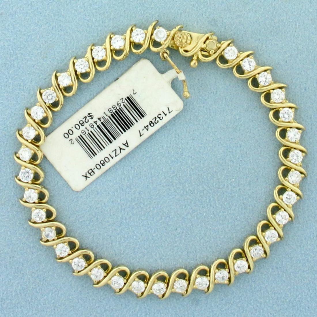 3.5ct TW CZ Tennis Bracelet In 18K Yellow Gold Over: In 18K Yellow Gold over sterling silver. Brand new with tag. Contains thirty six high quality 3mm CZ gemstones with excellent clarity and cut for extra sparkle. 7 1/2 inch long, 6.9 mm wide. 12.3g
