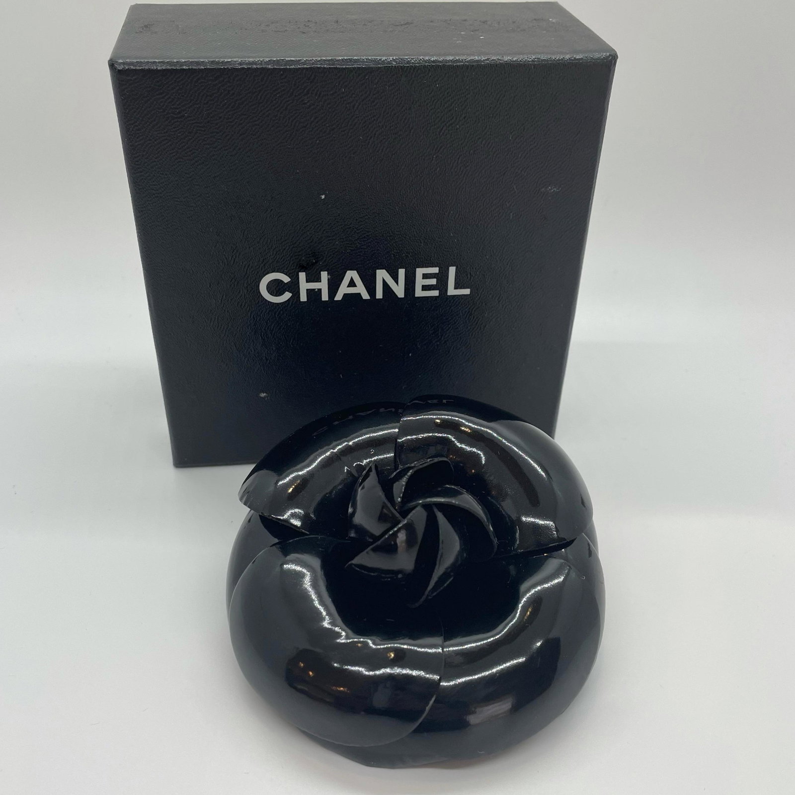 Authentic Chanel Black Patent Large Camellia Flower: Guaranteed authentic with original box. Measures approx. 3.75" in diameter. Rare find of a classic Chanel piece in signature black patent. In excellent condition, rarely worn. Hardware in excellent co