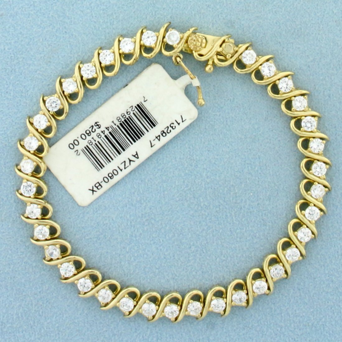 3.5ct TW CZ Tennis Bracelet In 18K Yellow Gold Over: In 18K Yellow Gold over sterling silver. Brand new with tag. Contains thirty six high quality 3mm CZ gemstones with excellent clarity and cut for extra sparkle. 7 1/2 inch long, 6.9 mm wide. 12.3g