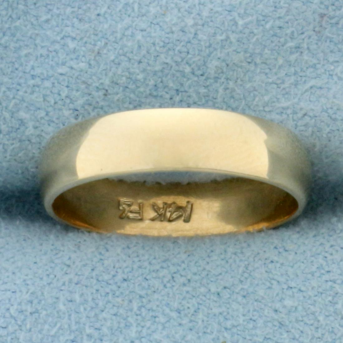 Wedding Band Ring in 14K Yellow Gold: In 14K Yellow Gold. 4.1mm wide. Size 5. 2.2g