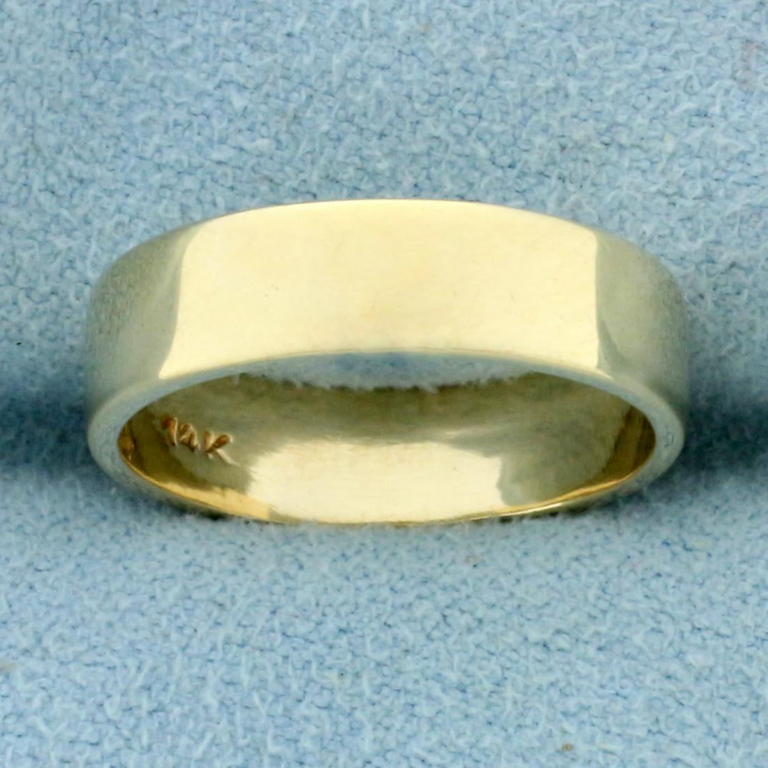 Wedding Band Ring in 14K Yellow Gold: In 14K Yellow Gold. 4.9mm wide. Size 5 1/2. 3.2g