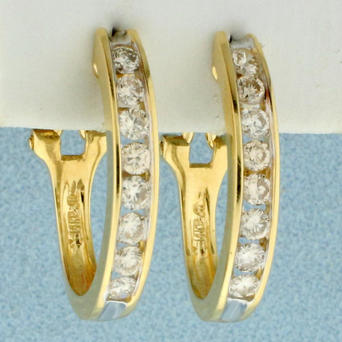 1ct TW Diamond Hoop Earrings in 14K Yellow Gold: In 14K Yellow Gold. Contains sixteen high quality Diamonds, 1ct TW, SI2 clarity/I color. 1 inch long, 3.7mm wide. 4.8g.