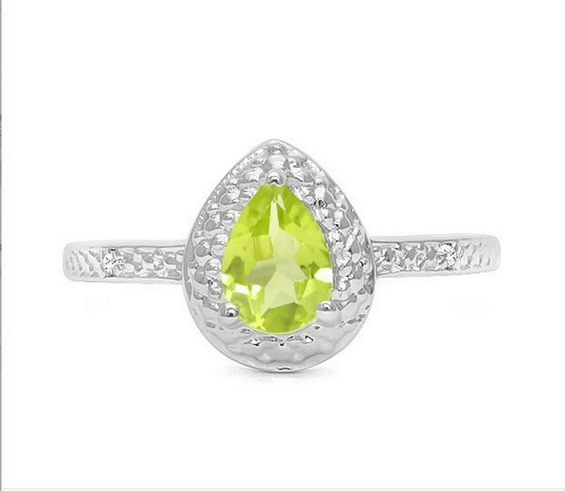 Peridot & Diamond Halo Ring in Sterling Silver: Pear cut .7ct peridot gemstone ring accented with .01ctw genuine diamonds. Size 6. Set in platinum over sterling silver, 2.1g.