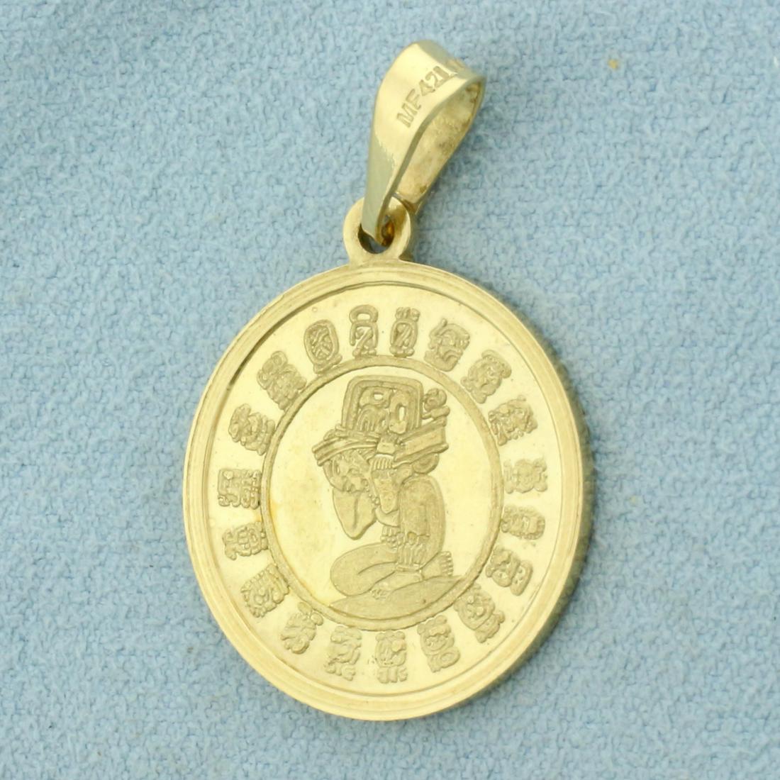 Aztec Sun Stone Pendant in 14K Yellow Gold: In 14K Yellow Gold. 7/8 inch diameter. 1 3/8 inch long with bale. 5.9g.