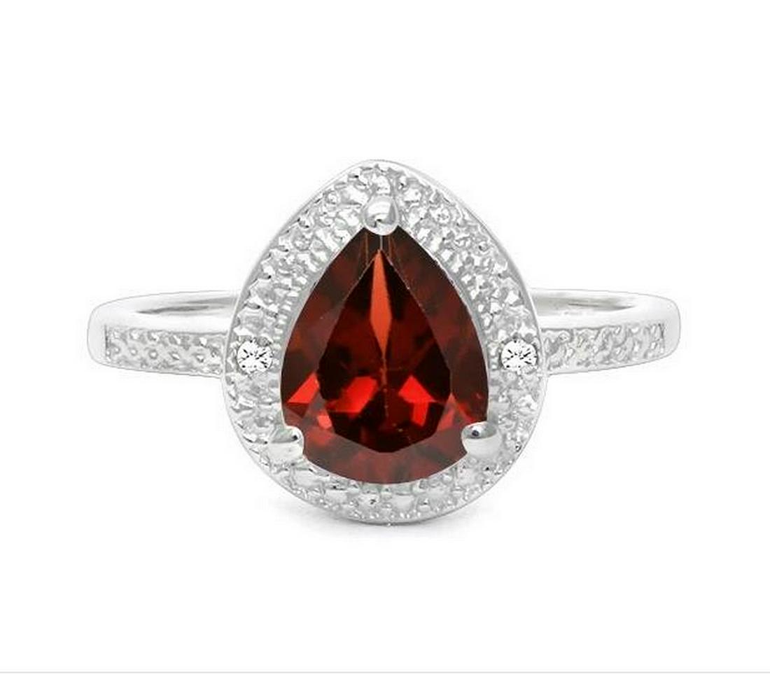 1.4CT Garnet & Diamond Halo Ring in Sterling Silver: Pear cut 1.4ct garnet gemstone ring, accented with .01ctw genuine diamonds. Size 7. Set in platinum over sterling silver, 3.3g.