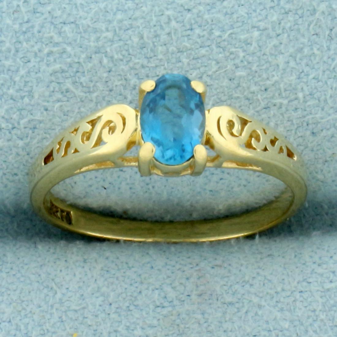 Swiss Blue Topaz Ring in 14K Yellow Gold: In 14K Yellow Gold. Size 4 1/2. Contains one high quality natural oval cut 6x4mm Swiss Blue Topaz gemstone with electric blue color and excellent clarity. 1.8g