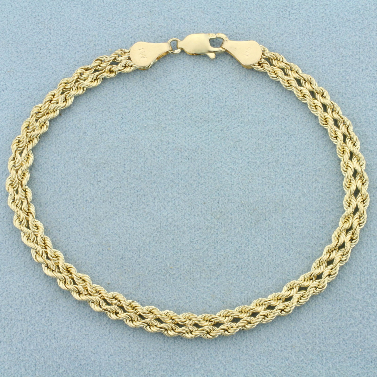Double Rope Link Bracelet in 10K Yellow Gold: In 10K Yellow Gold. 7 1/2 inches long, 4.8mm wide. Lobster clasp. 2.6g.