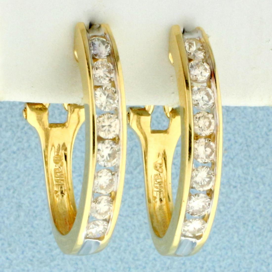 1ct TW Diamond Hoop Earrings in 14K Yellow Gold: In 14K Yellow Gold. Contains sixteen high quality Diamonds, 1ct TW, SI2 clarity/I color. 1 inch long, 3.7mm wide. 4.8g.