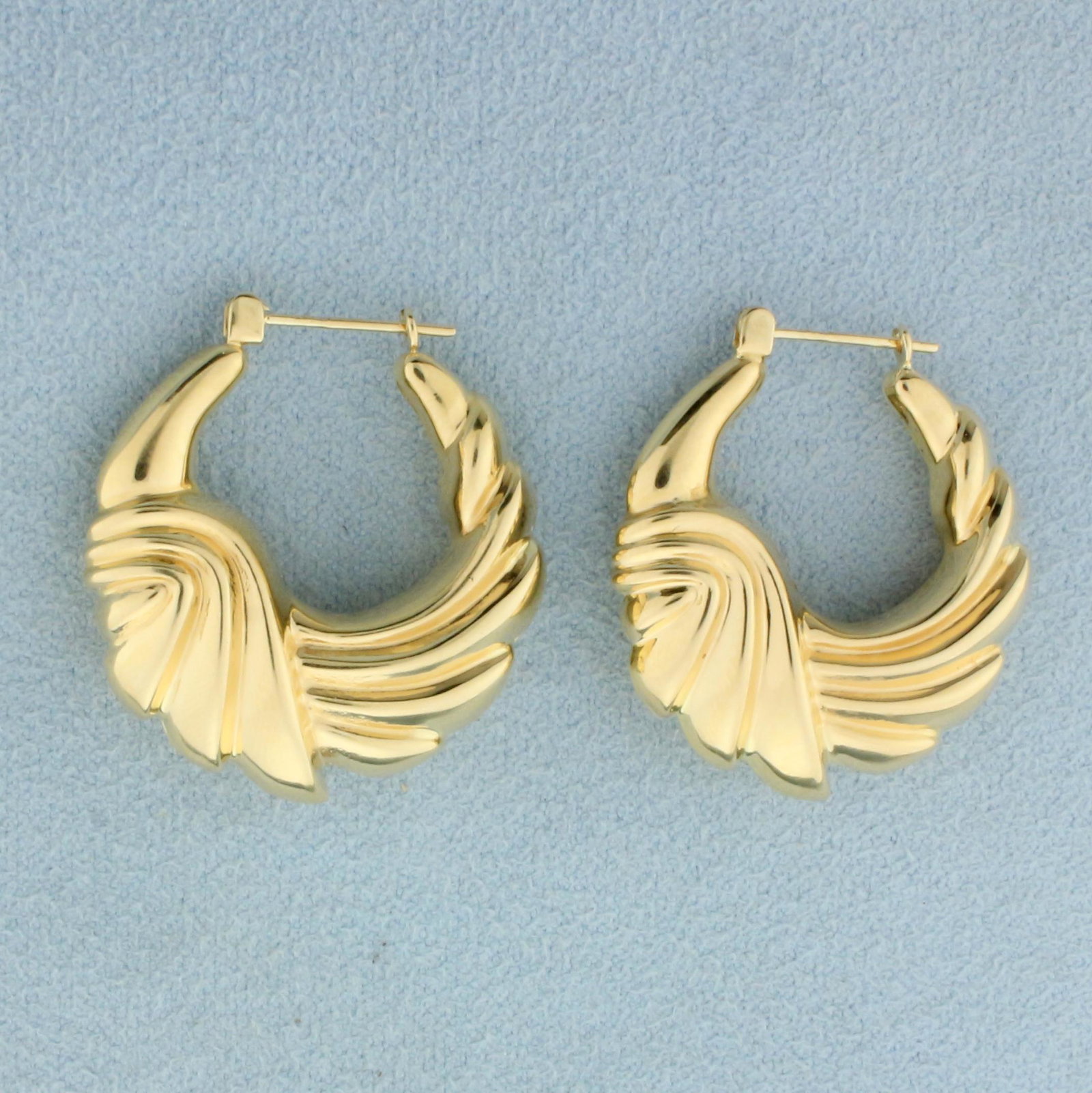 Abstract Design Hoop Earrings in 14K Yellow Gold: In 14K Yellow Gold. 1 inch long and wide. 3.7g