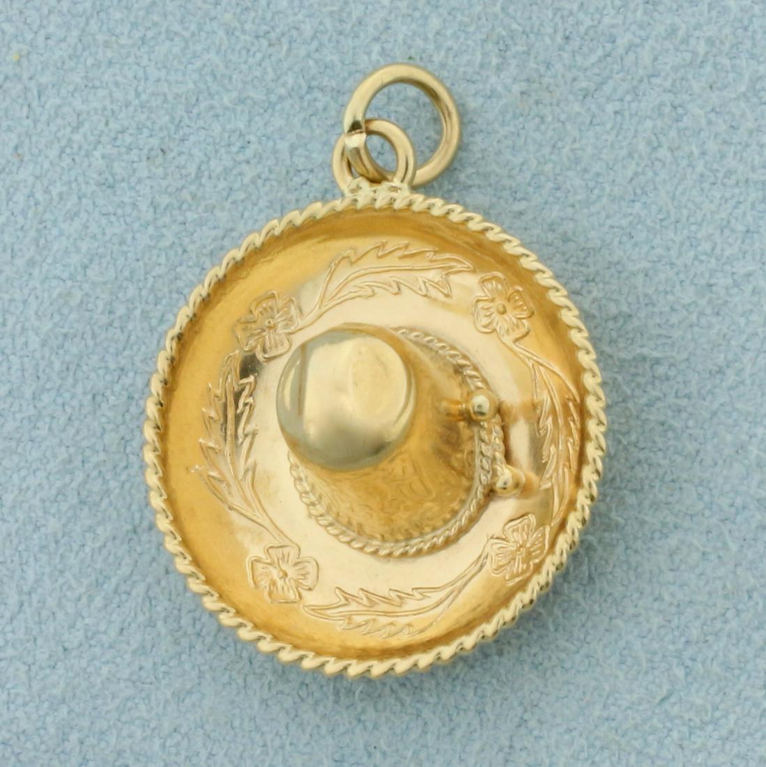 Sombrero Pendant or Charm in 14K Yellow Gold: In 14K Yellow Gold. 1 1/8 inches long including bale. 7/8 inch wide. 3.2g