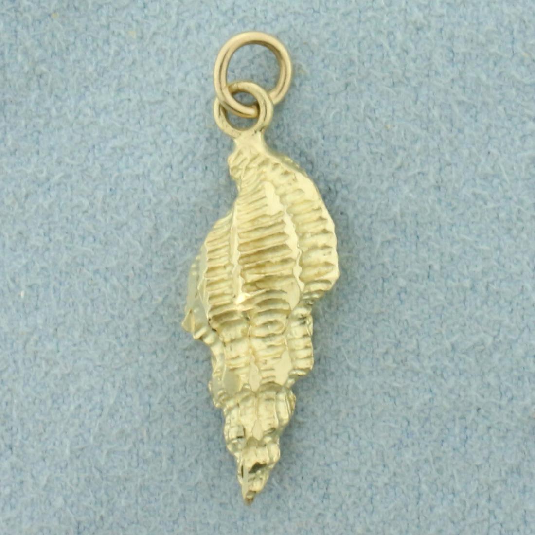 Seashell Charm or Pendant in 14K Yellow Gold: In 14K Yellow Gold. 1 inch long. 1.7g