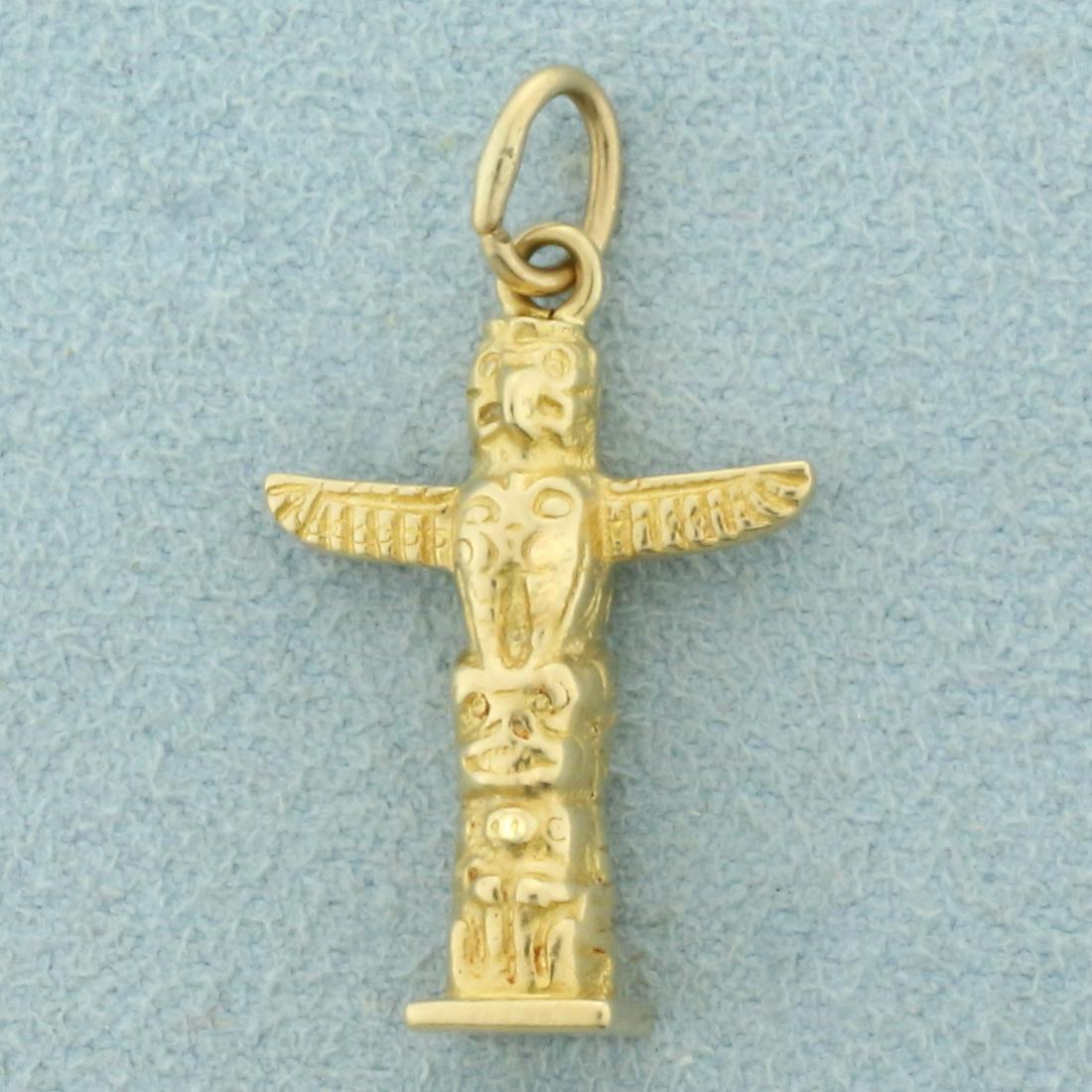 Totem Pole Pendant in 14K Yellow Gold: In 14K Yellow Gold. 1 inch long with bale, 5/8 inch wide. 2.7g.
