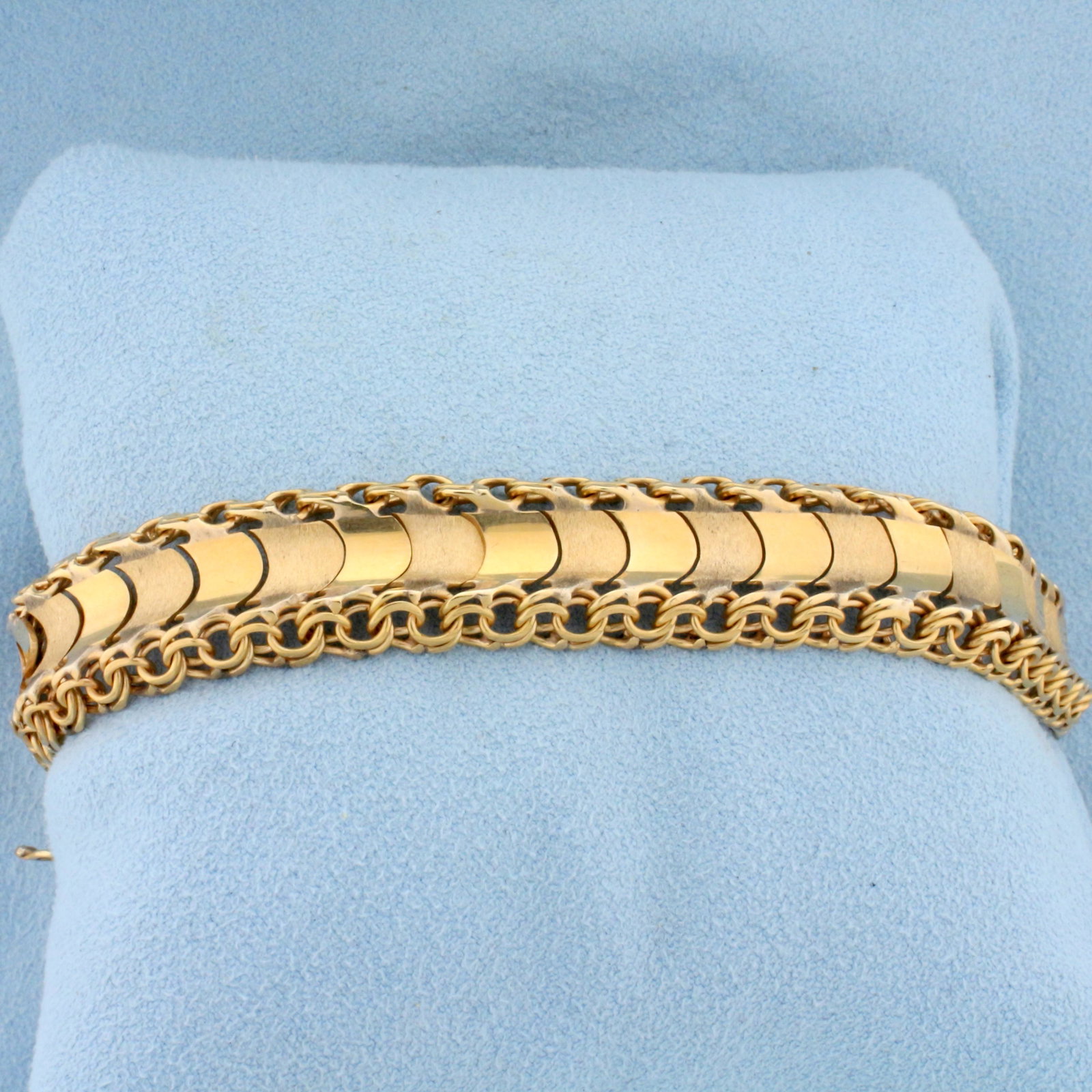 Heavy Designer Link Bracelet in 18K Yellow Gold: In 18K Yellow Gold. Unique alternating links of matte and shiny finish. 7 1/2 inches long. 13.8mm wide. With safety clasp and safety chain. 29.9g