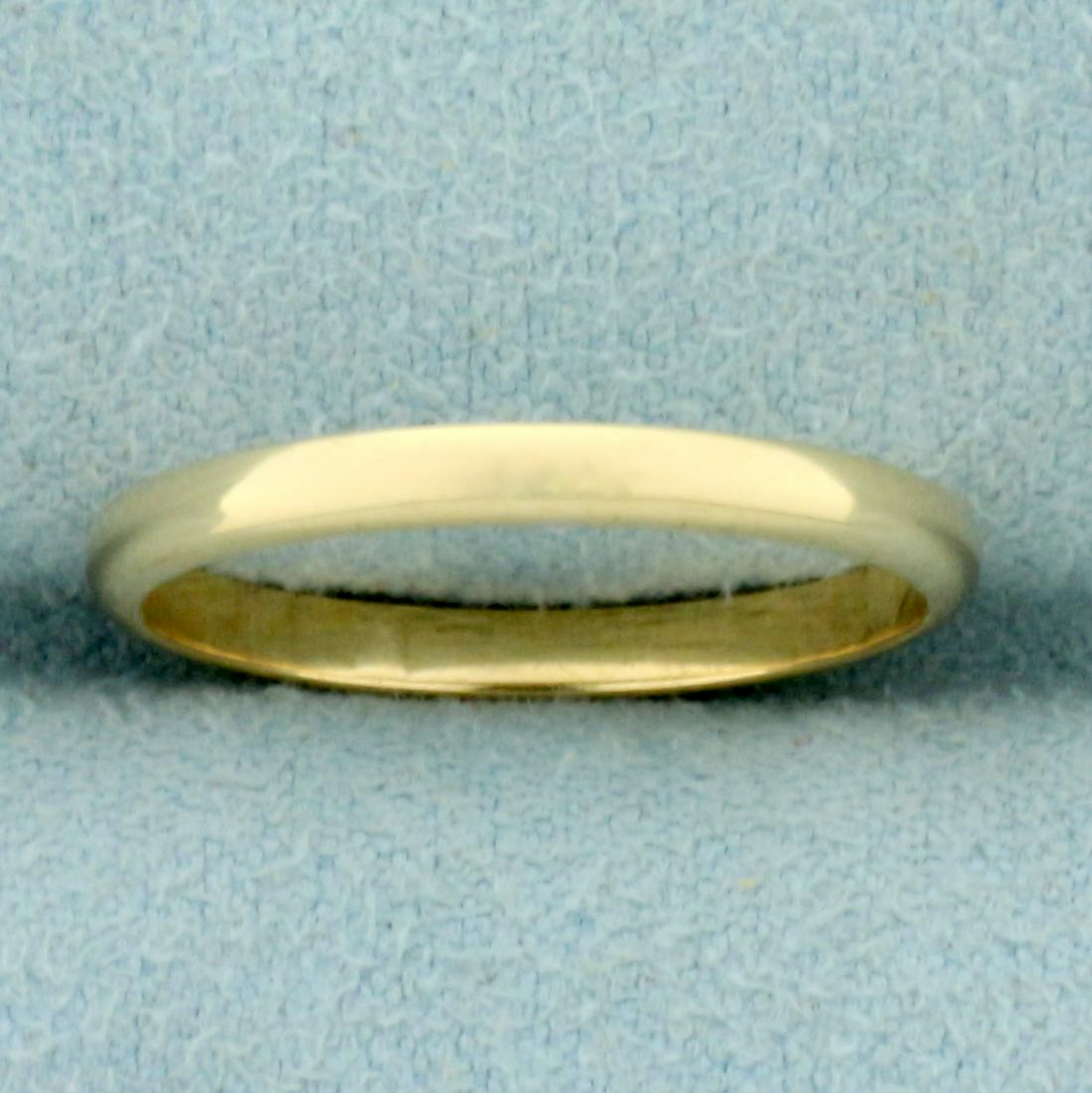 Thin Wedding Band Ring in 14K Yellow Gold: In 14K Yellow Gold. 2mm wide. Size 6. 1.5g.