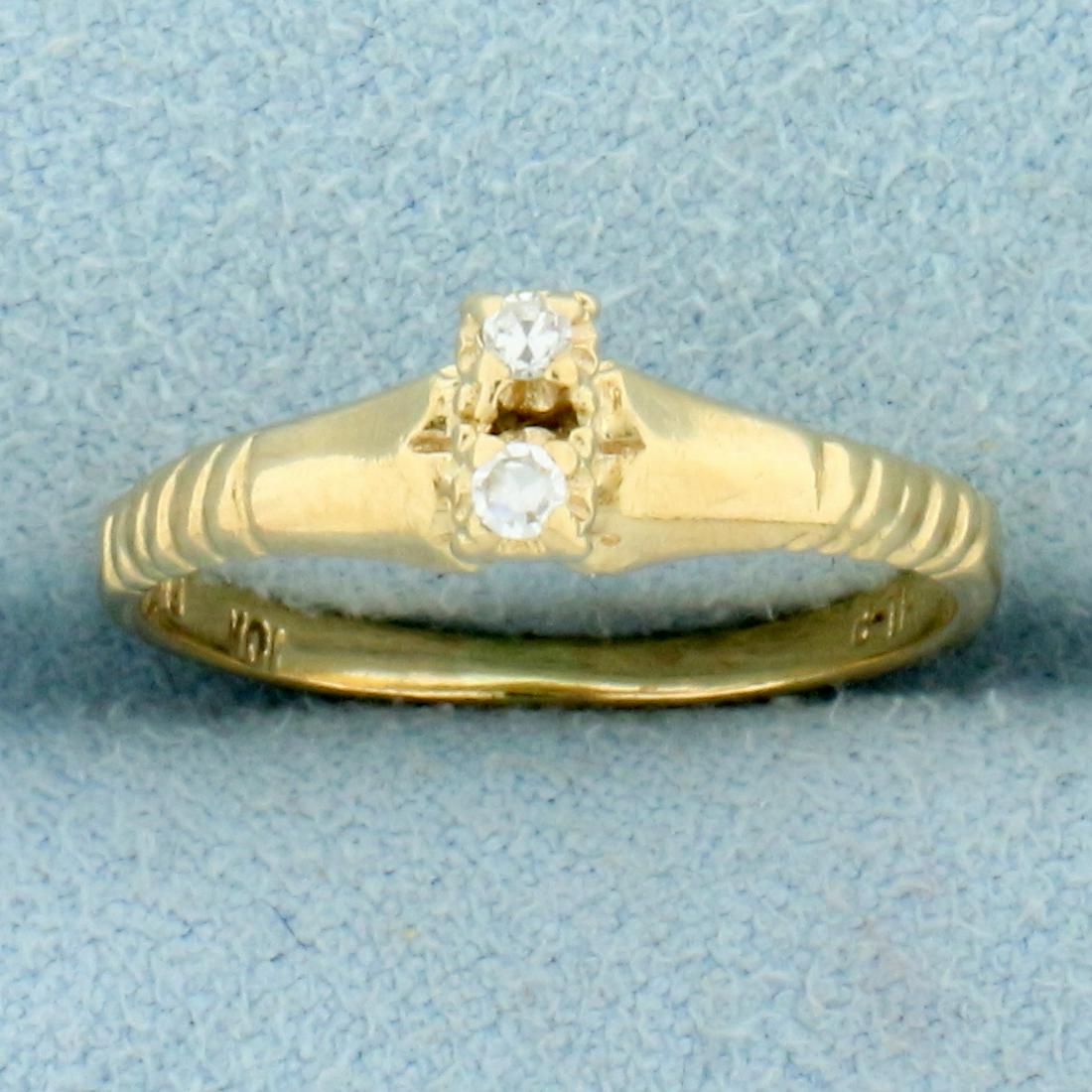 Two Stone Diamond Ring in 10K Yellow Gold: In 10K Yellow Gold. Size 5. Contains high quality round brilliant .02ct diamonds, SI clarity/H color. 1.6g