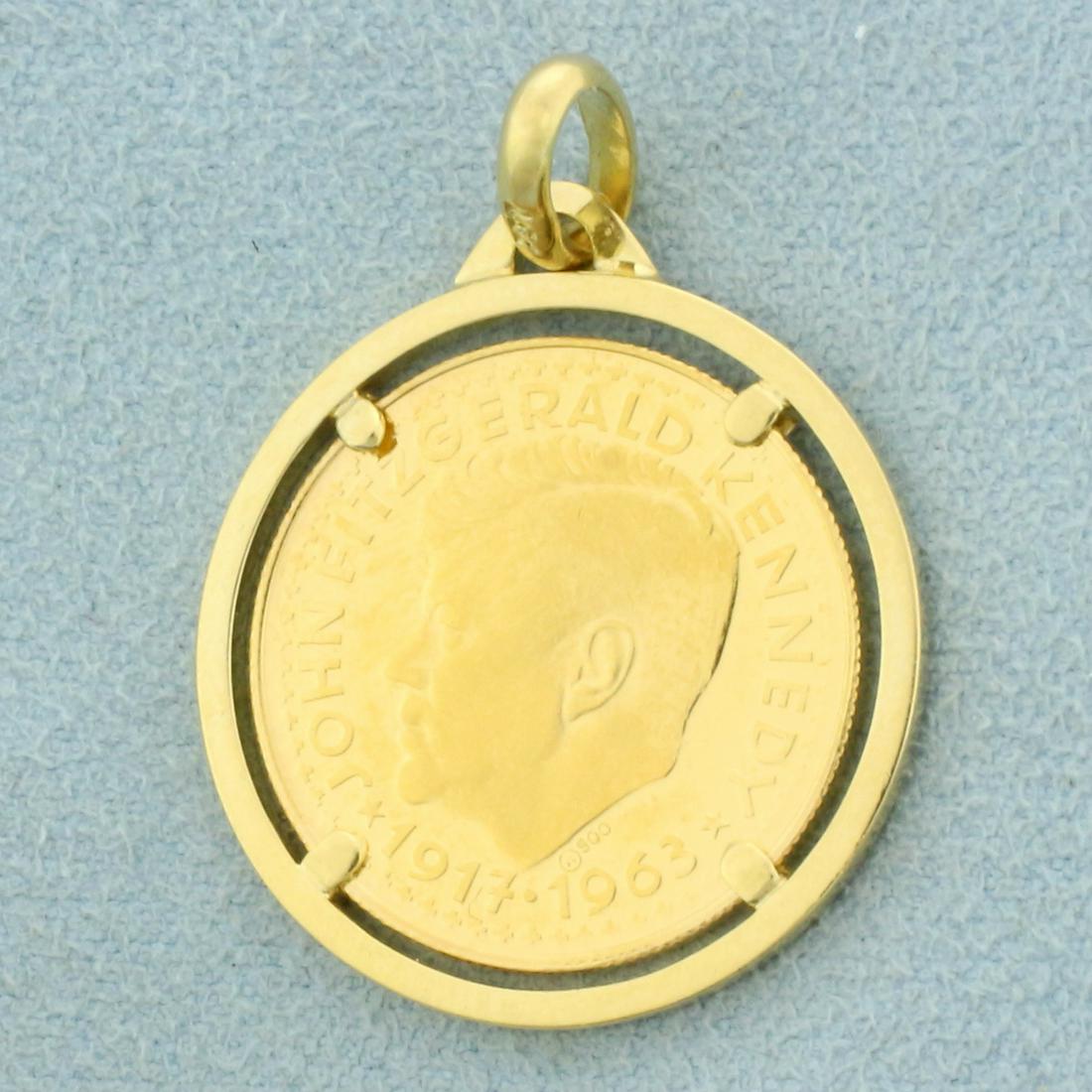 Rare JFK In Memoriam .999 Gold Coin in 18k Yellow Gold: In 18K Yellow Gold Pendant. JFK In Memoriam coin is .999 pure gold. 7/8 inch diameter, 1 1/4 inches long with bale. 6.7g.