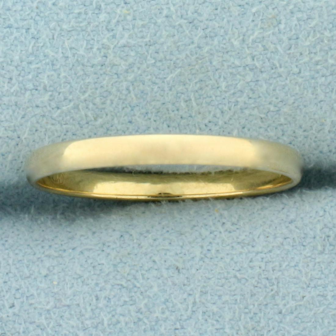 Thin Wedding Band Ring in 14K Yellow Gold: In 14K Yellow Gold. 2mm wide. Size 8 1/2. 1.4g