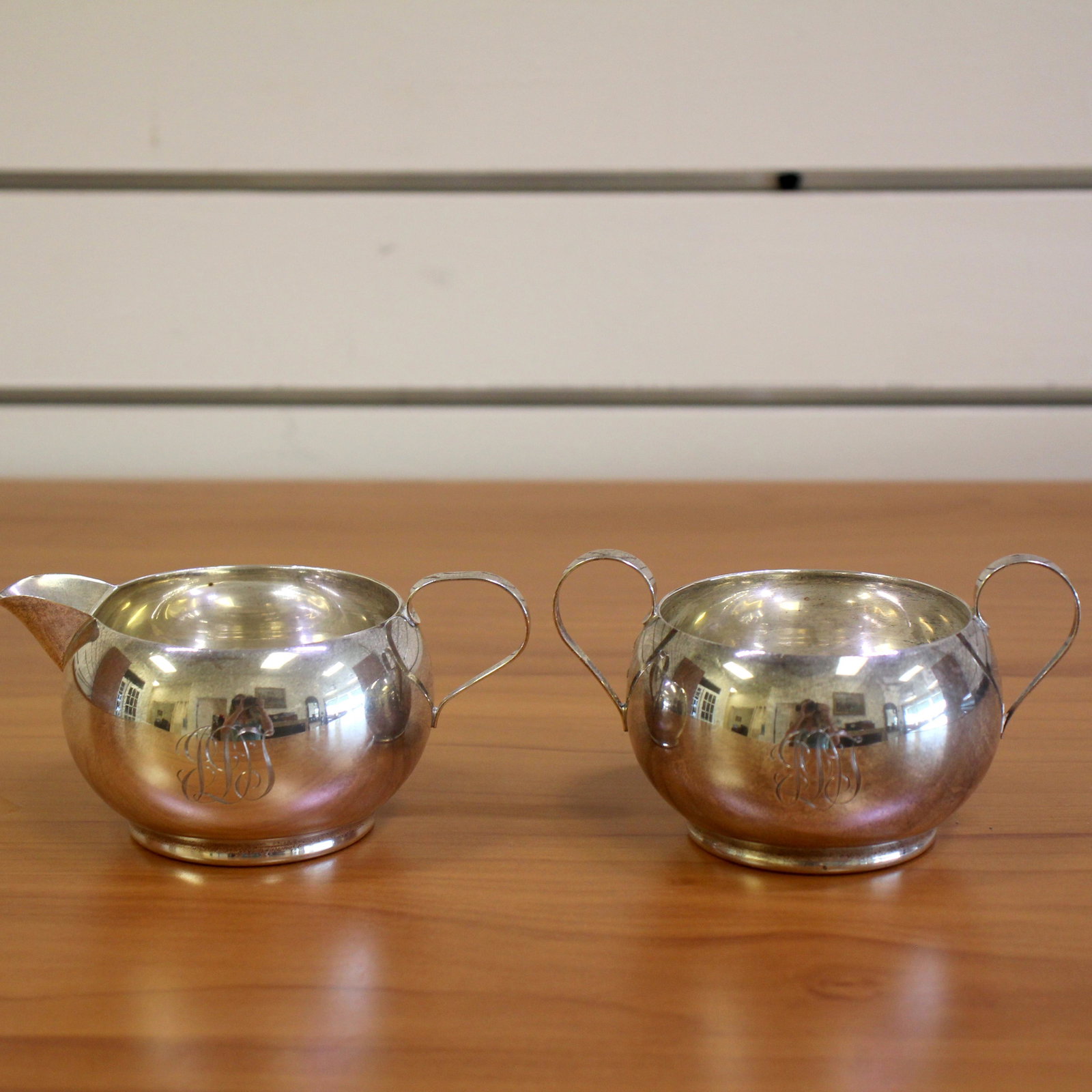 Hamilton Sugar Bowl and Creamer Set in Sterling Silver: In Sterling Silver. 2 1/4 inch height. 2 1/4 inch width. 212.3g
