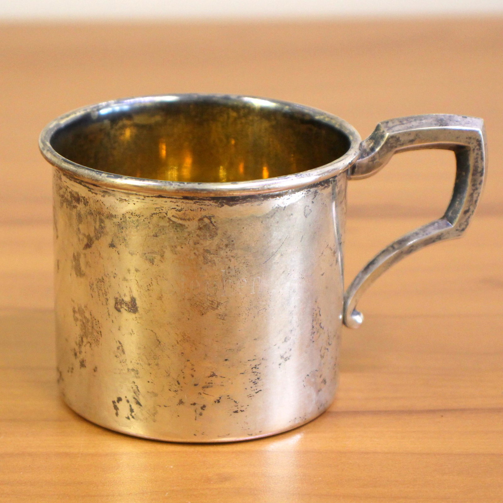 Antique Web Engraved Stephen Sterling Silver Mug: In sterling silver. 2 1/4 inch width. 2 1/4 inch height. "Stephen" engraved on the front side. 52.1g