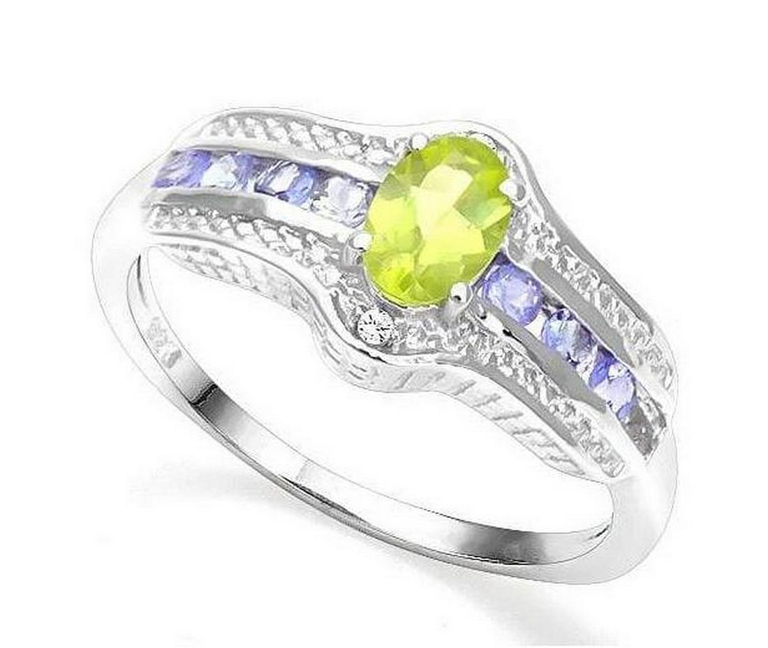 Peridot, Tanzanite, & Diamond Ring in Sterling Silver: Ring contains 1-oval cut peridot gemstone, .50cts, and 8-round cut tanzanite gemstones, .32ctw, and is accented with .01ctw genuine diamonds. Size 7. Set it platinum over sterling silver, 2.8g.