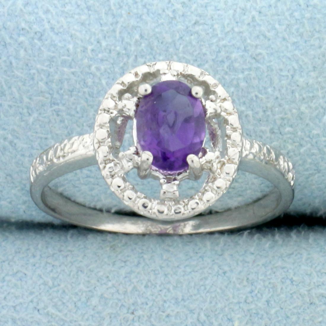 Amethyst Open Halo Diamond Ring in Sterling Silver: Oval cut .75ct amethyst gemstone ring, accented with .01ctw genuine diamonds. Size 8. Set in platinum overs sterling silver, 2.5g.