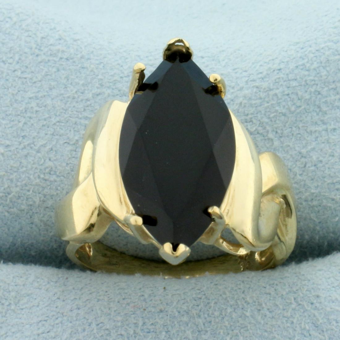 Onyx Solitaire Statement Ring in 10K Yellow Gold: In 10K Yellow Gold. Contains one high quality natural 20x10mm marquise cut Onyx gemstone. Size 7 1/2. 5.1g