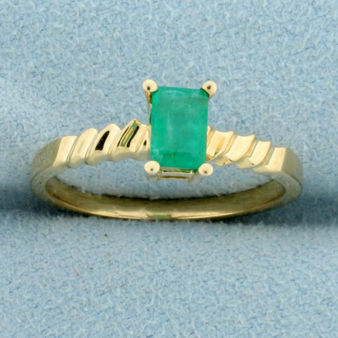 1/2ct Emerald Solitaire Ring in 14K Yellow Gold: In 14K Yellow Gold. Contains one high quality natural 6x4mm Emerald gemstone with bright green color. Size 8. 2.2g.