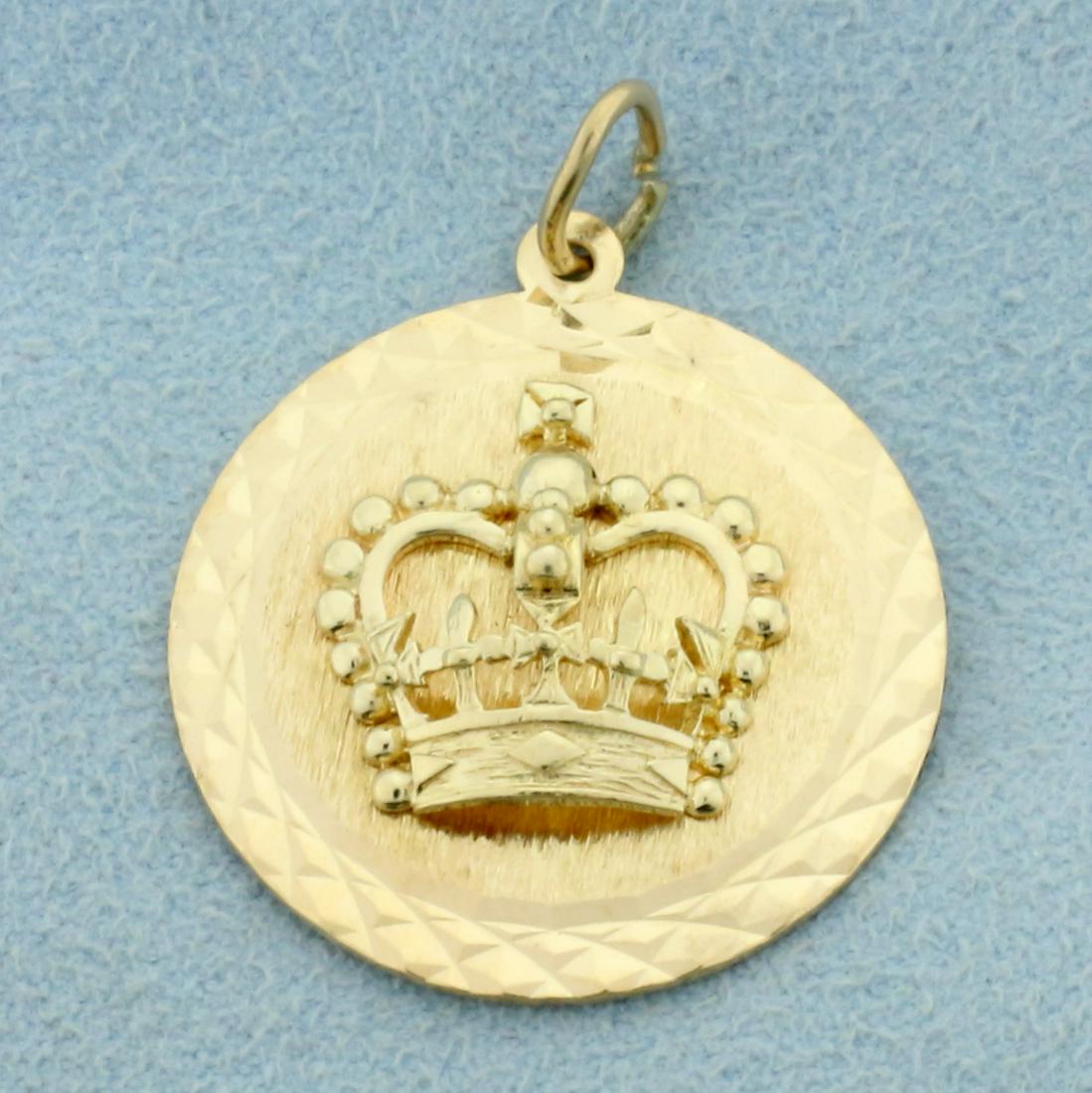 Royal Crown Pendant in 14K Yellow Gold: In 14K Yellow Gold. 1 1/4 inches long with jump ring. Back is blank to inscribe name or date. 5.2g.