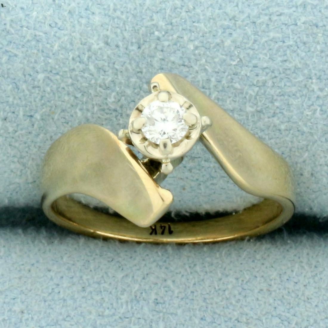 Solitaire Diamond Engagement Ring in 14K Yellow Gold: In 14K Yellow Gold. Contains one high quality 1/8ct round brilliant Diamond, VS clarity/H color. Size 5 3/4. 3.2g.
