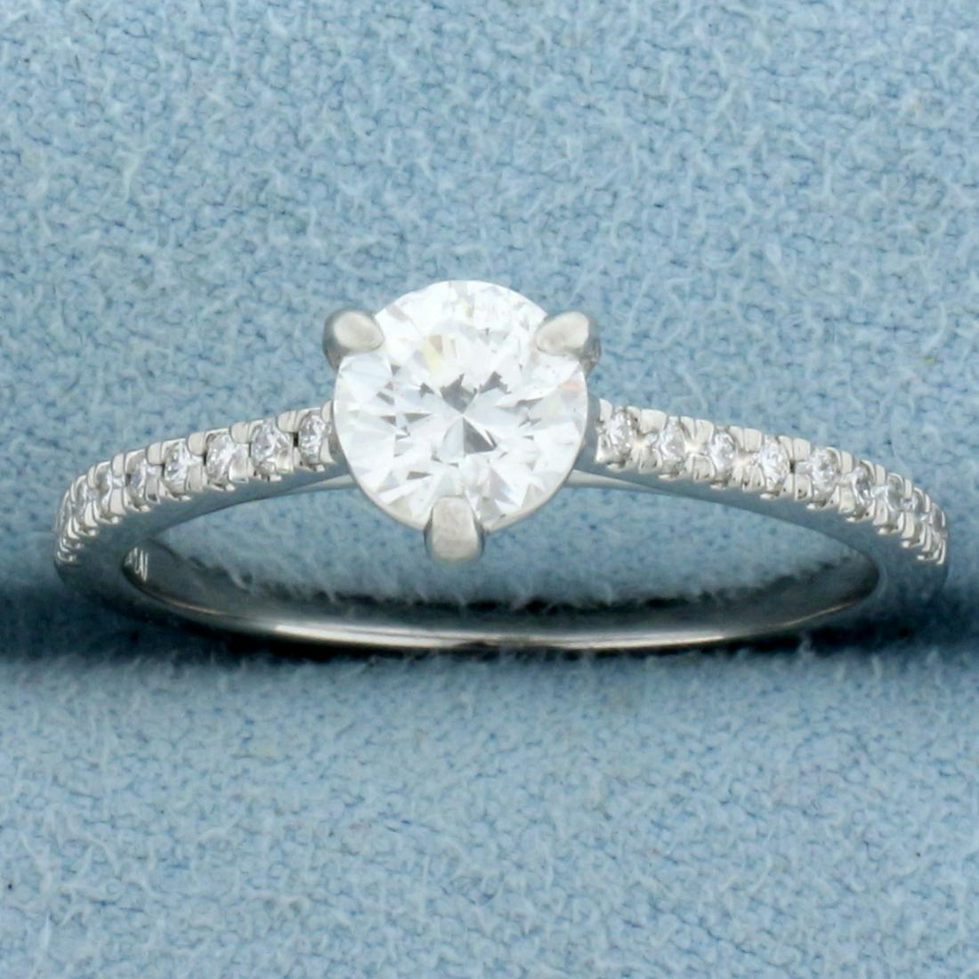 Almost 1ct TW Diamond Engagement Ring in Platinum: In Platinum. Center Diamond is a high quality .72ct Round Brilliant, H color, I1 clarity, completely eye clean and great cut for lots of sparkle. Also contains 18, .01 ct diamonds in shank, H color/SI