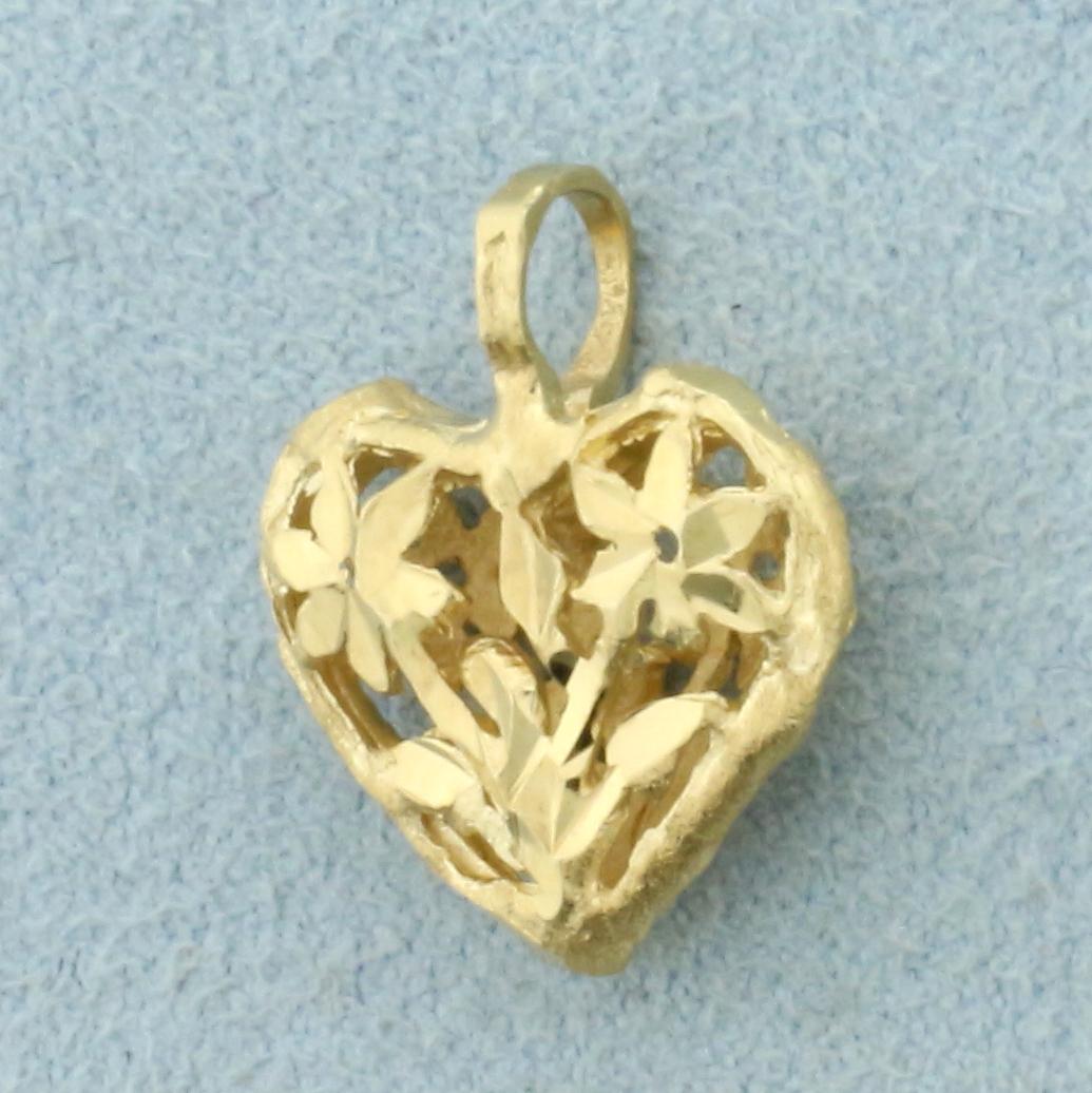 Diamond Cut Flower Heart Pendant in 14K Yellow Gold: In 14K Yellow Gold. 5/8 inch long, including bale. 1/2 inch wide. 1.5g